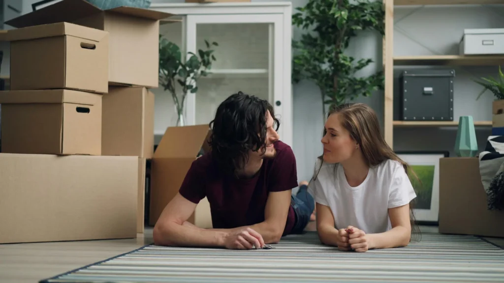 a happy couple preparing for relocation